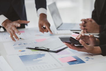 Atmosphere of a startup company meeting, business people are meeting together to summarize and plan investment finances, they are the founders of the company. Business administration concept.