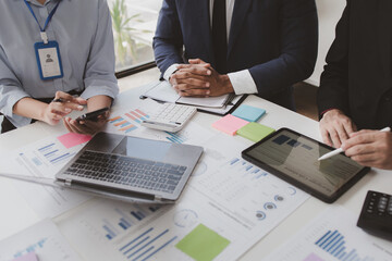 The sales department is having a monthly summary meeting to bring it to the department manager, they are verifying the correctness of the documents that are prepared before bringing in to the manager