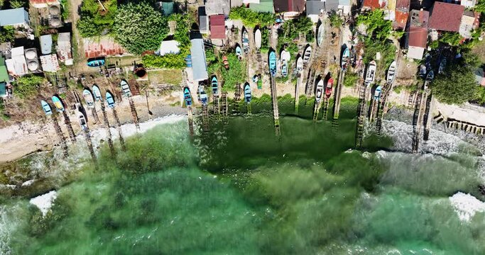 Aerial view over beach coast of Cape Shabla, the easternmost point of Bulgaria and the fishing village with old boats