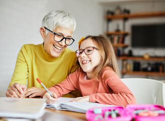 grandchild grandmother family granddaughter child teacher homework creativity home woman book...