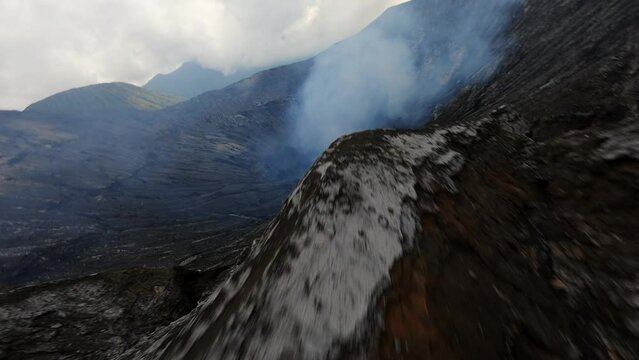 The mouth of a smoking volcano inside