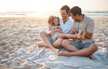 Gay parents, father and girl at beach with love, smile and hug for vacation, laugh or outdoor on...