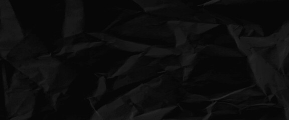 Texture of black crumpled paper, black crumpled paper texture in low light background,
dark paper background with chaotic bends, black wrinkled paper texture.
