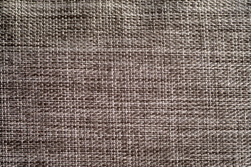 Grey nylon fabric close-up, uniform texture background. Selective focus