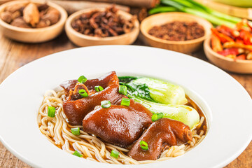 A bowl of pork knuckle noodles