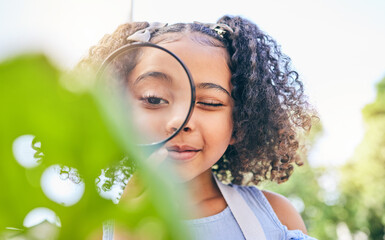 Girl child, magnifying glass and plants in garden, backyard or park in science, study or outdoor....