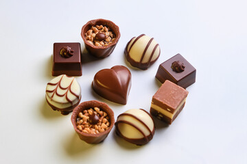 collection of beautiful delicious chocolate candies isolated on white background