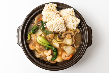 Fried glutinous rice soup with seafood on white background