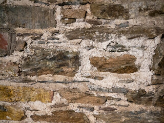 Old stone wall pattern close view background, ancient bricks surface
