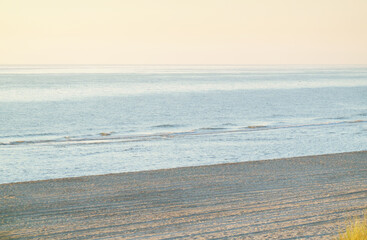 Subtle colour tones in pink and blue on the beach at sunset, near Noordwijk, Netherlands 