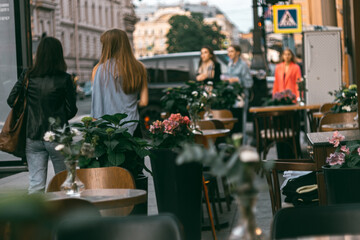 terrace restaurant summer girls in the background of a sunny evening promenade.Takeaway menu 