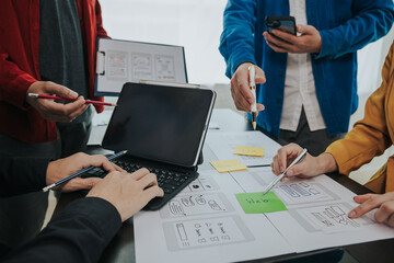 Developer team brainstorm creative teamwork plan, intimate mobile app developer team meeting on...