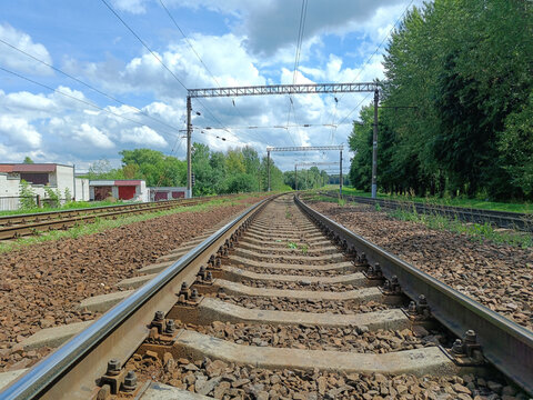 Multi-track railway track with poles and wires for powering electric trains