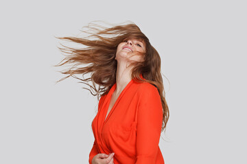 Beautiful woman with windy hair, studio portrait