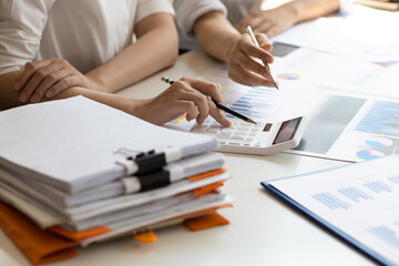 Businesswoman colleague discuss planning, budget management, accounting, business in office.