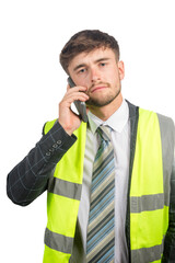 Man in a suit wearing a hi-vis vest
