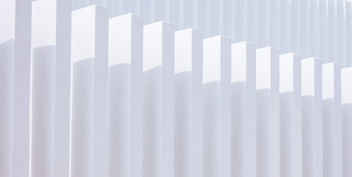 White concrete fence with outdoor wall and abstract architecture. Clear and beautiful shadows. modern design ideas