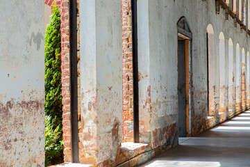 Old Abandoned Brick Building with Wooden Door and Windows