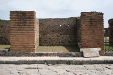 Ruins of a Store front on the decumani in the ancient city of Pompeii