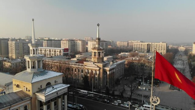 Kyrgystan flag in Bishkek city center. Aerial drone view. Flying over. High quality 4k footage