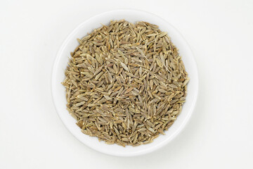 Top view of cumin seeds isolated on white background