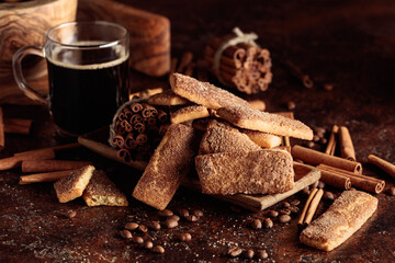 Sweet cinnamon cookies and a mug of black coffee.