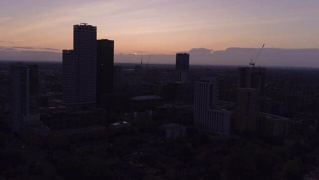 Drone's View Aerial Journey of Downtown Croydon, England, UK in 4K, Capturing the City Skyline, East Croydon Station and Skyscrapers concept for Stunning Sunset Over Urban Landmarks.