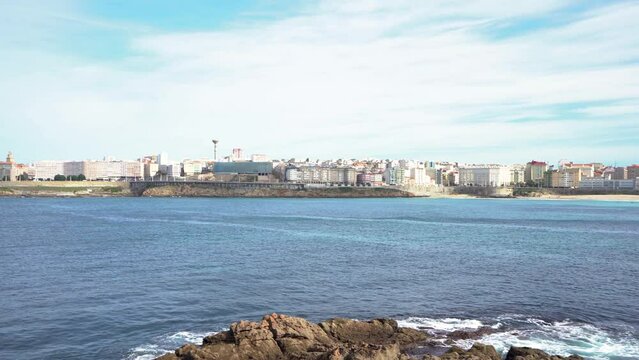 Beautiful A Coruna city. Situated in Galicia, Northwest of Spain. Travel destination. Panoramic view of the city. View of Riazor Beach and Orz&aacute;n beach. Travel destination. Camera pan right. Stabilized