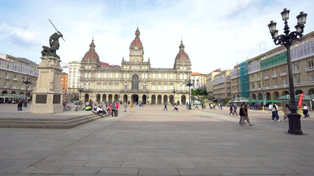 View of Mar&iacute;a Pita Square in city center of A Coruna. In background is the Town Hall Building. At left is Maria Pita Statue. Travel destination. Stabilized footage