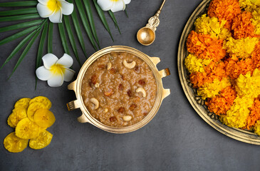 Temple payasam with flowers, Onam special Ari Payasam or sarkara payasam arranged in brass vessel 