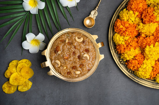 Temple payasam with flowers, Onam special Ari Payasam or sarkara payasam arranged in brass vessel 