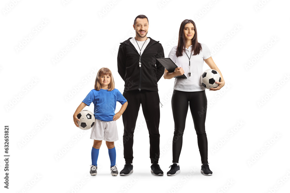 Poster Little girl football player holding a ball and standing with coaches