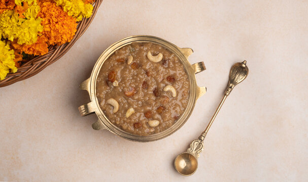 Top view of Payasam with spoon, Banner type image of Ari payasam also known as Sarkrak payasam, Kerala festival Onam special sweet dessert arranged in brass vessel