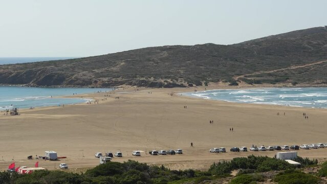 Prasonisi beach on the island of Rhodes is an isthmus with the Aegean Sea on one side and the Mediterranean on the other