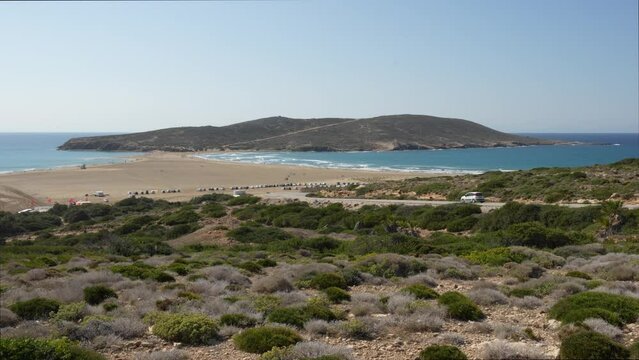 Prasonisi beach on the island of Rhodes is an isthmus with the Aegean Sea on one side and the Mediterranean on the other