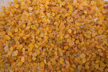 Dried fruits Yellow sweet delicious raisins pattern texture can be used as a background wallpaper