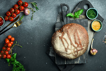 Fresh rye bread. Bread with Ukrainian symbols. The Ukrainian Trident is depicted on bread. Top view.