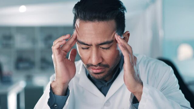 Tired, man or scientist with headache stress in a laboratory overworked with burnout, migraine pain or fatigue. Exhausted, frustrated or researcher working on medical science research with problem