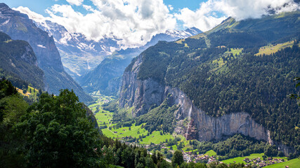 View to Lauterbrunnen and the Staubachfall waterfall and the mountains from the village Wengen in Switzerland