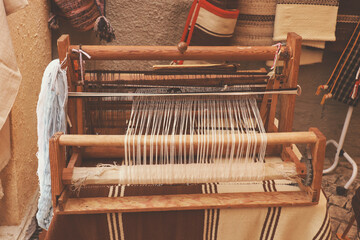 A closeup image of an old weaving Loom in a street market - 632664072
