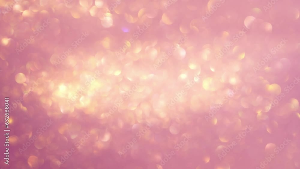 Wall mural abstract motion of gold bokeh lights on pink background. blurry gold particles in liquid float and g