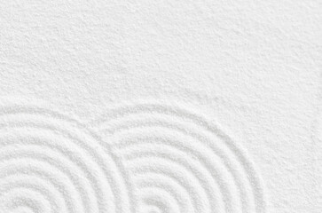 Sand texture with simple spiritual patterns,Japanese Zen Garden with concentric circles and parallel lines on  white sandy surface background,Harmony,Meditation,Zen like concept