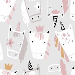 Vector hand-drawn seamless repeating childish simple pattern with cute unicorns in Scandinavian style on a gray background. Children's texture with unicorns. Horse. Funny animals sketch. © ZHUKO