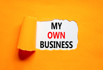 My own business symbol. Concept words My own business on beautiful white paper. Beautiful orange background. Business motivational my own business concept. Copy space.