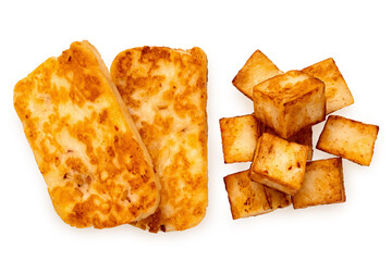 Two fried slices and cubes of halloumi cheese with red chilli isolated on white from above.