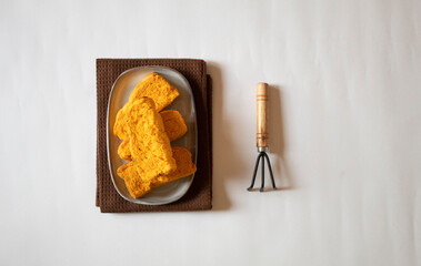 Rusks with a small garden fork minimal flat lay