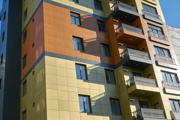 High and luxurious apartments with a summer blue sky on the background.