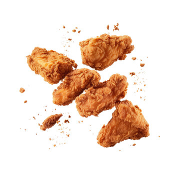 Levitating food frozen fried chicken pieces on white surface.