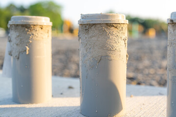 Naklejka premium Concrete Test Cylinders on a construction site. 