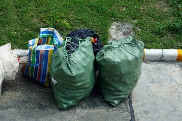 A collecting a garbage bags preparing go to recycle.